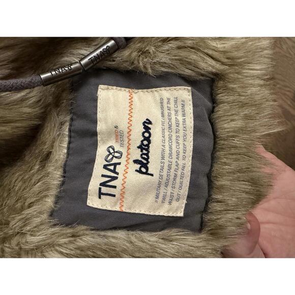 Aritzia TNA Platoon military utility jacket in grey with a faux-fur lined hood. - Picture 8 of 13